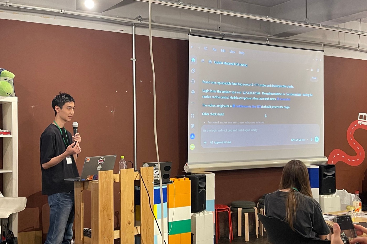 Presenter showing AI agent output detecting a login redirect bug across 45 HTTP probes